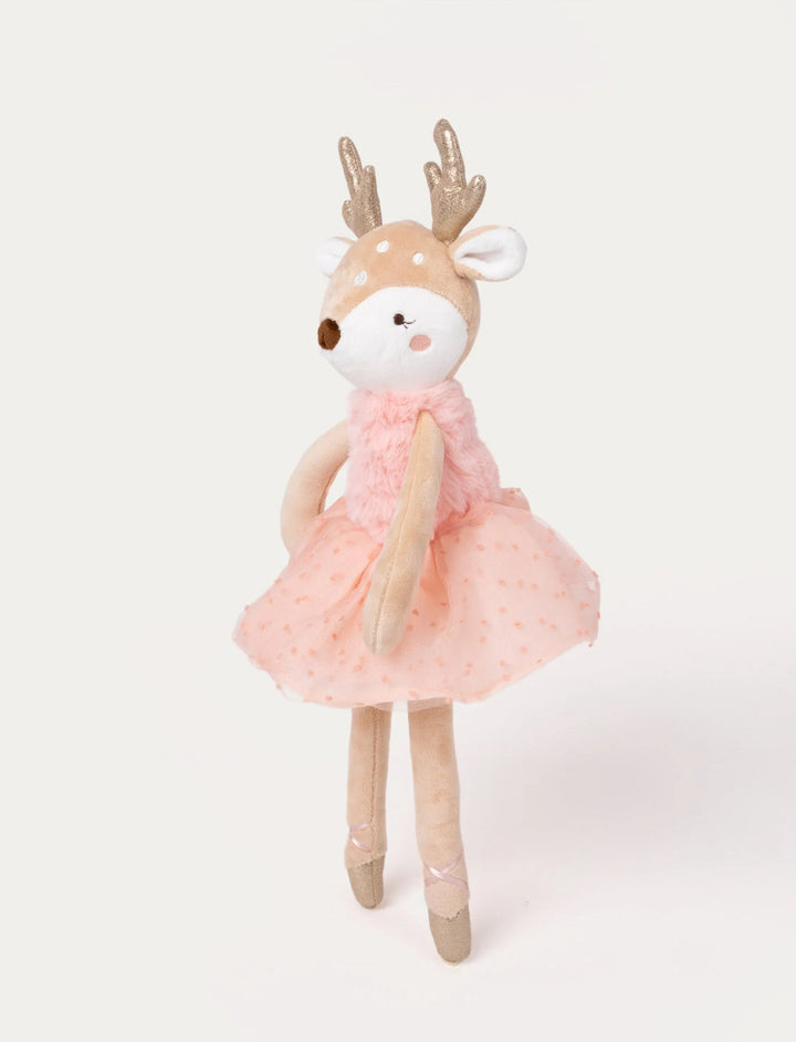 Angled side view of the Ballerina reindeer Ruth soft toy showing her pink fluffy bodice and spotted deer details, Baby Belle.