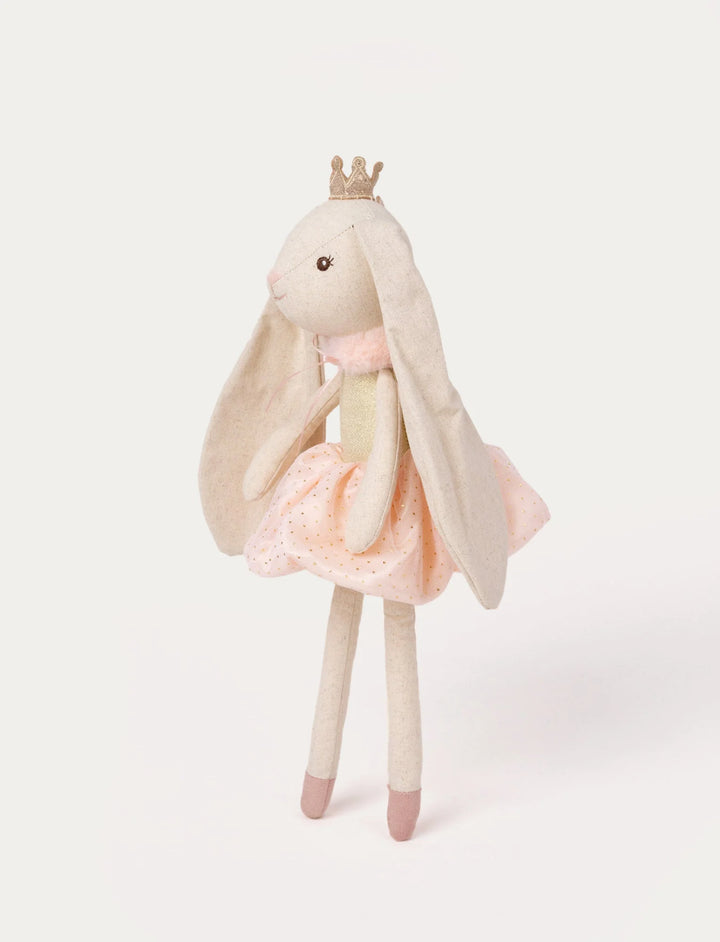 Angled view of the Ballerina Bunny Line soft toy showing her long ears, gold crown, and pink tulle skirt, Baby Belle.