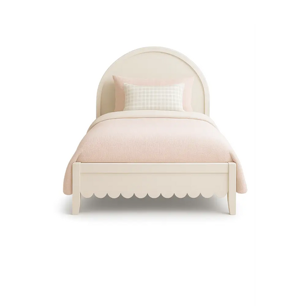 The Fleur Bed front view – children’s bed with arched headboard and scalloped footend, styled with blush bedding and handcrafted by Baby Belle Kids Furniture