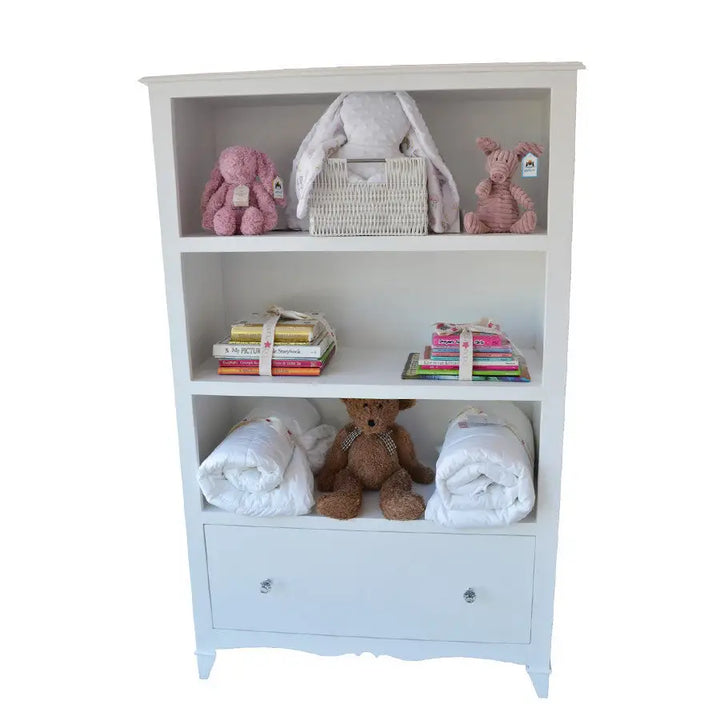 Hand‑crafted Bellarina nursery bookshelf with drawer and carved plinth, custom hand‑painted finish.

