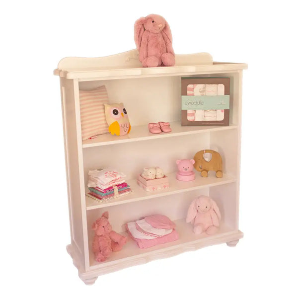 Handcrafted French-style bookshelf with carved crest and three open shelves, painted in non-toxic finish, ideal for nursery or children’s room
