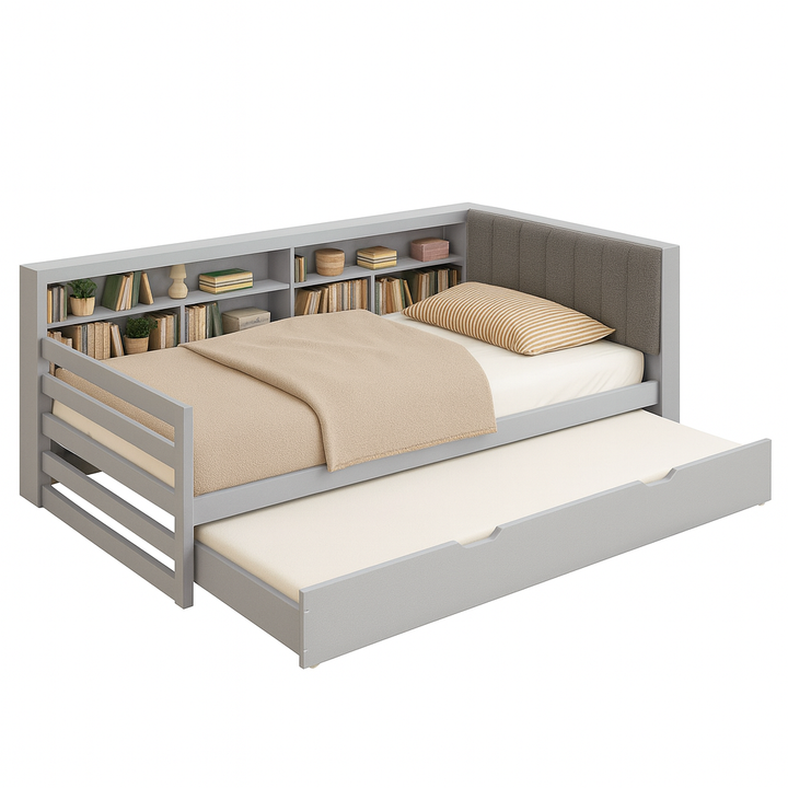 The Josh Bed in grey – a handcrafted kids’ daybed with built-in bookshelf, fluted upholstered headboard, and pull-out trundle by Baby Belle.