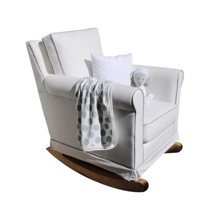 res Chic Rocking Chair in white with solid wooden rocking legs, featuring a plush cushioned seat styled with a toy lamb and throw blanket.
