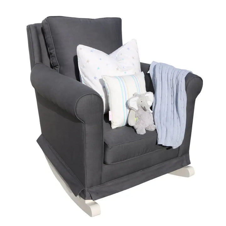 Tres Chic Rocking Chair in charcoal  with hand-painted white rocking legs, styled with star and stripe scatter cushions, a plush grey elephant, and a soft blue throw for a modern nursery setting.