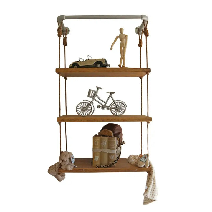 Sebastian Rope Shelf by Baby Belle made from solid French Oak, featuring three floating shelves suspended with rope and a steel bar, styled for children's rooms
