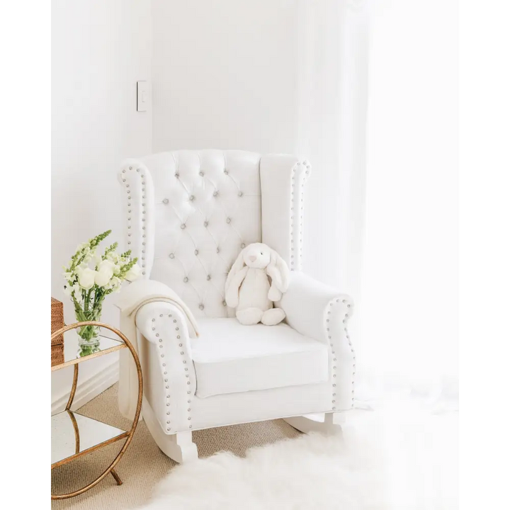 Luxury Ava Rocking Chair in white with tufted wingback, stud detailing, and plush cushioning – styled in Jenna McArthur’s nursery by Baby Belle South Africa