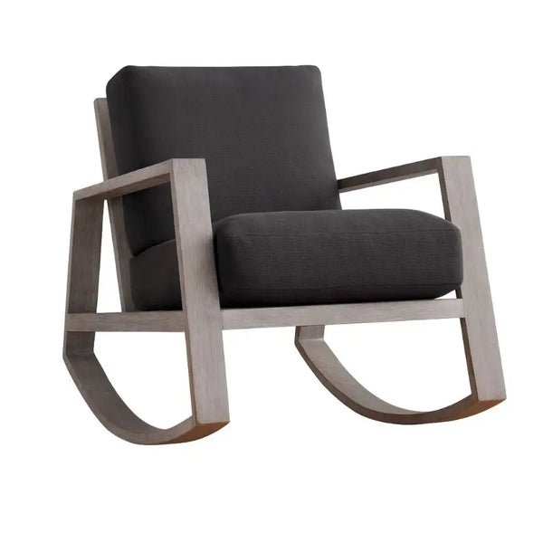 Modern Harvey rocking chair with a weathered wood frame and deep charcoal upholstered cushions, featuring clean angular lines and a contemporary silhouette.