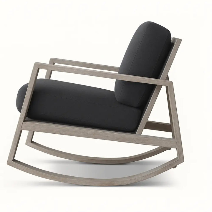 Modern Harvey rocking chair with a weathered wood frame and deep charcoal upholstered cushions, featuring clean angular lines and a contemporary silhouette.