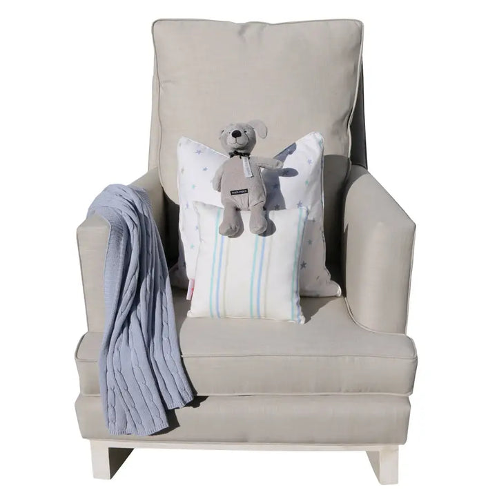 Sandstone Jayden rocking chair styled with a star cushion and a blue throw draped over the arm.