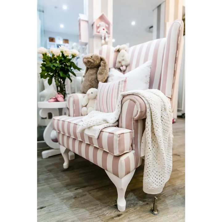 Baby Belle Oliver Feeding Chair in pink and white stripe fabric with classic wingback design and Queen Anne legs, luxury nursing and feeding chair handcrafted in South Africa.
