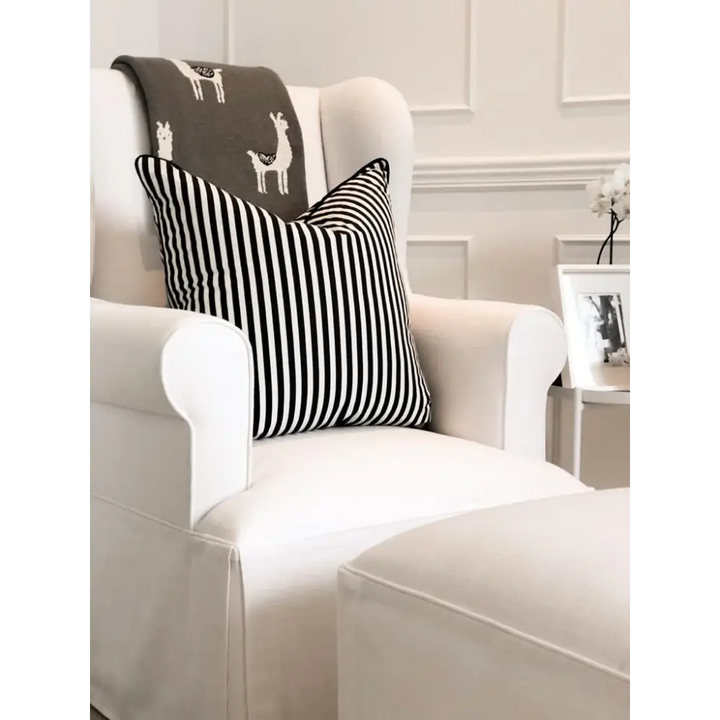 Family lifestyle photo featuring the Baby Belle Rose Feeding Chair with slipcover and ottoman, elegant wingback nursing chair with pleated skirt design, handcrafted in South Africa.